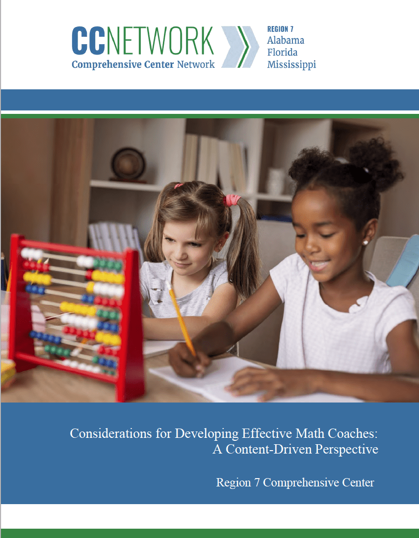 Two young girls sitting at table working on math