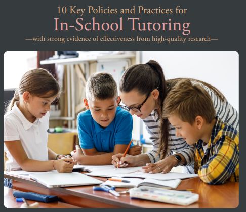 A teacher tutoring students in school